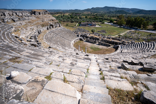 Panoramic view of ruins of antique Greek theatre in Miletus on western coast of Anatolia in ancient Caria, modern Turkey