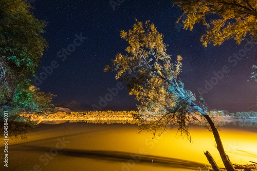 Outdoor scene depicting a starry sky over the orange river in South Africa.