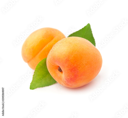 Sweet apricots with leaves on white backgrounds