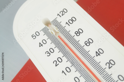 Thermometer with high temperature on flag of Poland. Hot weather in Poland concept.