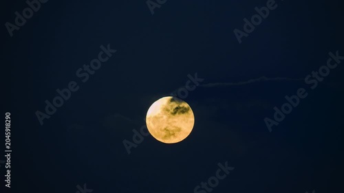 A bright full moon glowing in the dark night sky, captured over Shimen, New Taipei, Taiwan, showcasing lunar craters and celestial beauty.