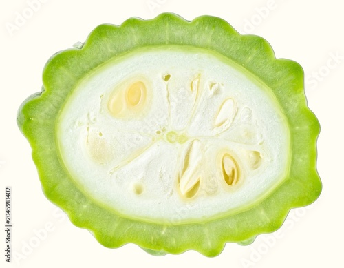 Sliced Raw Green Snake Gourd Vegetable Displaying Internal White Spongy Tissue Isolated on White Background