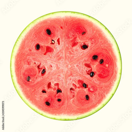 Slice of red watermelon with black seeds and green rind isolated on white background, refreshing summer fruit photography