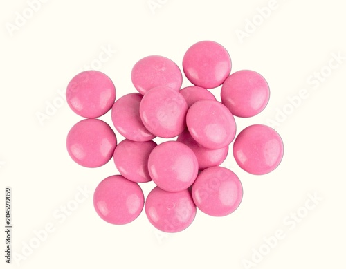 Small Pile of Premium Pink Ruby Chocolate Callets Expertly Isolated Over a Plain White Background