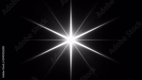 Glowing Twinkling Star Flare on Black Background. Shiny Optical Light Burst with Sparkle Rays 4K Loop. Bright White Starburst Light Effect on Dark Background. Lens Flare Sparkle Animation 4K
