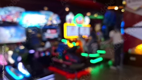 Blurred colorful neon lights in an arcade center.