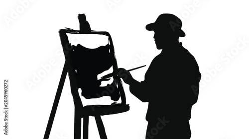 Artist silhouette stands before a wooden easel, capturing the creative process in high contrast as the dark figure interacts with the canvas texture under bright, studio-style lighting conditions.