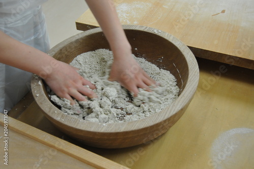 Here, they are kneading buckwheat flour by hand to make soba noodles.