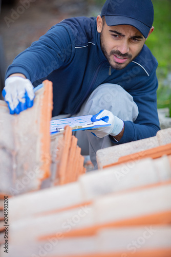 young happy man tiling on rooftop