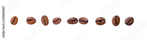 A pile of brown coffee beans, a lot of roasted beans lies and flies, isolated, on a white background