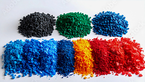 Flat lay conceptual background showcasing a gradient color palette of industrial microplastic waste and synthetic materials