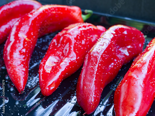 Bild auf Leinwand Fresh Red Romano Peppers on a Gas Grill