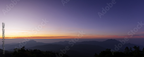 Beautiful natural panoramic countryside landscape with mountains at sunrise. Rainforest ecosystem and healthy environment concept background. Nature background.