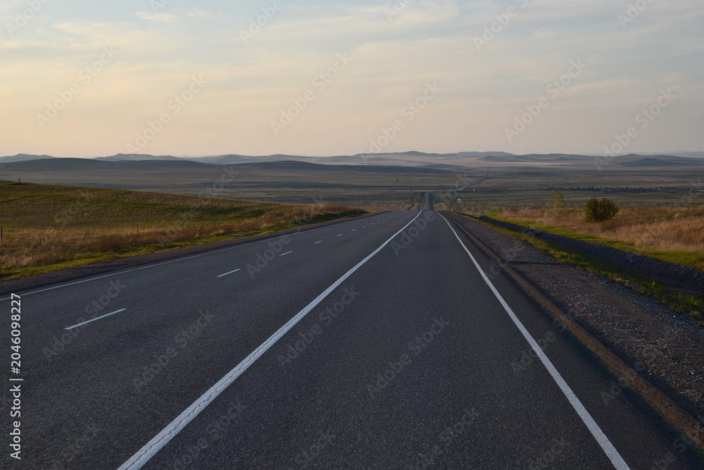 Fototapeta premium Country road. Siberian scenery. Republic of Khakassia, Russia