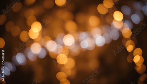 Glitter vintage lights background. gold, silver, blue and black. de-focused.