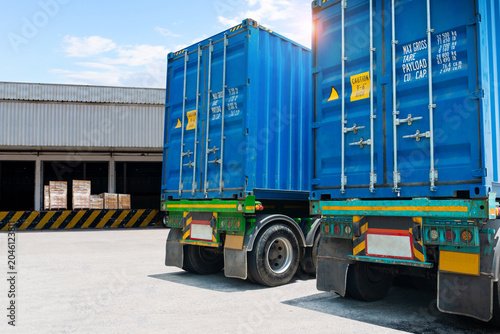 Semi Trailer Trucks on the parking lot at Warehouse. Freight Transportation Logistics Truck. Shipping Cargo Container. Trucks Loading Goods at Dock Warehouse. Distribution Warehouse.