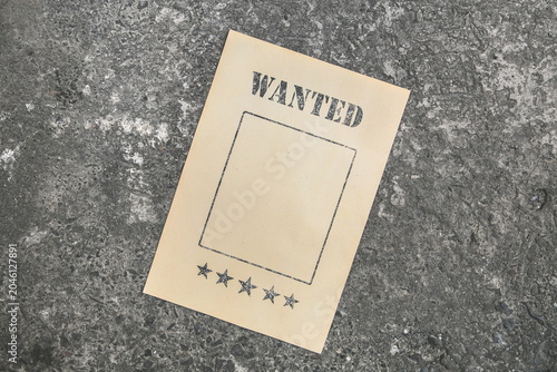 old paper wanted poster on grunge background
