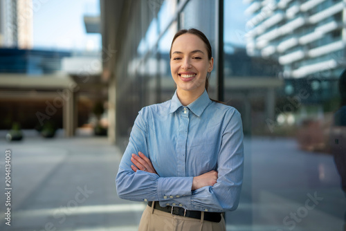 Schilderij op canvas Confident businesswoman smiling, portraying professionalism and success