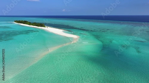 Aerial view of a tropical island with a white sandbank and turquoise coral reefs, Fulhadhoo, Baa Atoll, Maldives.