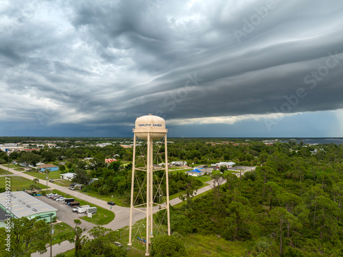 Fotografie Tropical rainstorm above Charlotte Harbor water tower