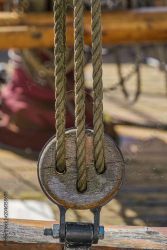 Close-up of a pulley on an old sailing ship in a harbor on the Baltic Sea.