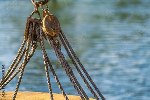 Close-up of a pulley on an old sailing ship in a harbor on the Baltic Sea.