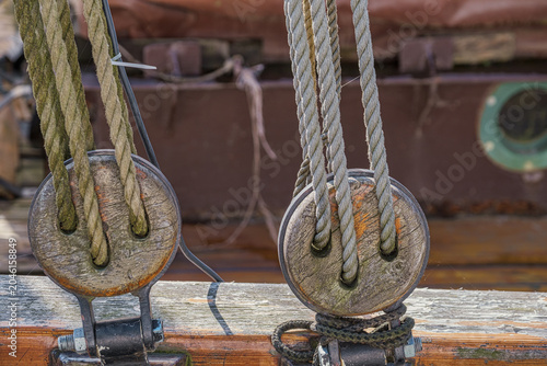 Close-up of a pulley on an old sailing ship in a harbor on the Baltic Sea.