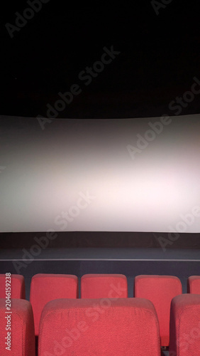 Modern movie theater interior before screening, entertainment concept