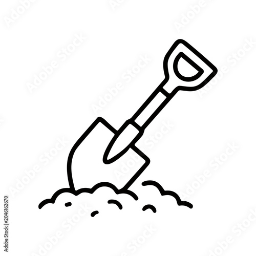 Fotografi Shovel digging into the ground.