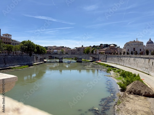 Scenic view of the Tiber River flowing through the historic center of Rome, Italy