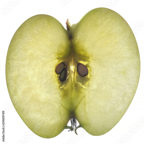 Backlit thin slice of a green apple revealing its core and seeds, highlighting fresh cellular texture