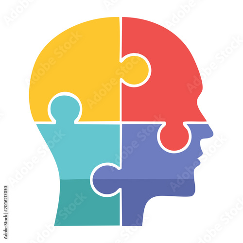 Human head silhouette made of colorful puzzle pieces
