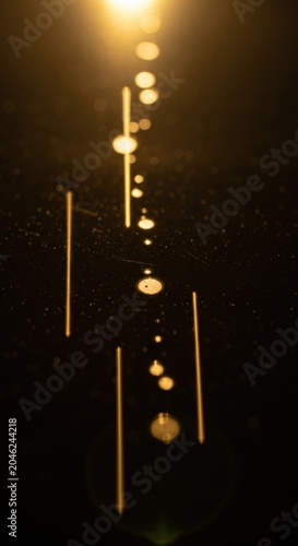 Golden light, abstract illustration, glowing dots, futuristic design element