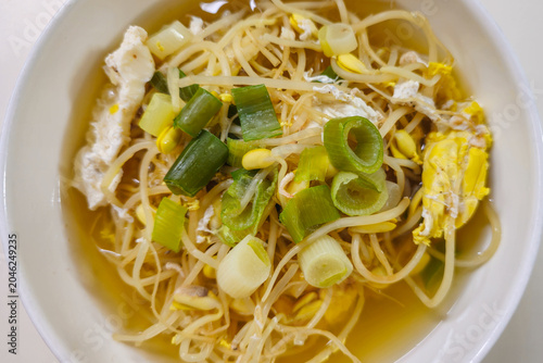Traditional Korean soybean sprout soup with egg and green onion in clear broth, a healthy homemade Korean comfort food served as a warm everyday meal.
