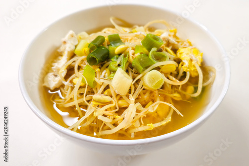 Traditional Korean soybean sprout soup with egg and green onion in clear broth, a healthy homemade Korean comfort food served as a warm everyday meal.