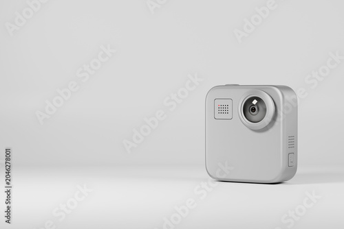 Compact action camera on gray background with copy space