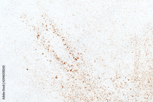 White Surface Showing Brown Dust Speckles Scattered Across Textured Background Closeup Minimal Debris Pattern On Light Backdrop For Material Detail And Texture Study.