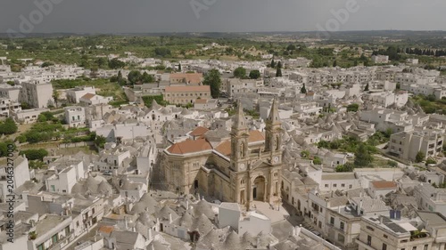 Aerial views of Alberobello’s iconic trulli rooftops, winding streets, and sunlit limestone houses, capturing the charm and symmetry of this UNESCO-listed Italian village.