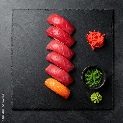 Delicious Nigiri Sushi Platter with Tuna and Salmon on Black Slate.