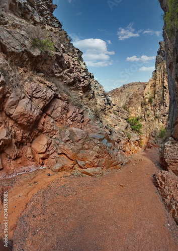 Northern Kyrgyzstan. Picturesque winding trails of the Kok Moinok canyons with red-brown rock along the Chu River.