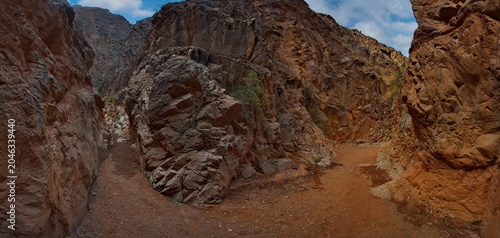 Northern Kyrgyzstan. Picturesque winding trails of the Kok Moinok canyons with red-brown rock along the Chu River.