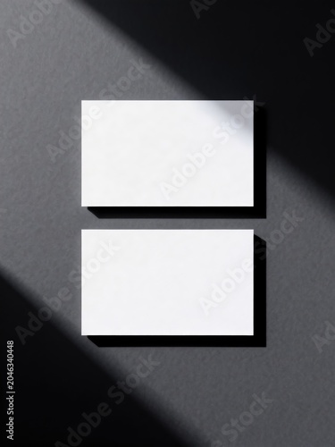 Clean business card mockup with dramatic shadows and minimalist layout, idea for branding identity presentation and premium stationery design