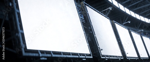 Row of large blank white LED billboard screens in a professional sports stadium for advertising mockup