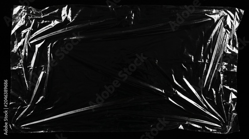 Crumpled plastic wrap sheet closeup texture landscape background
