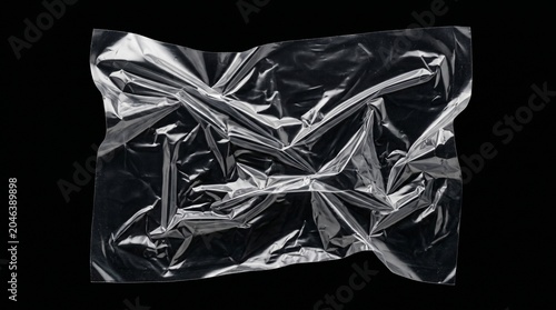 Crumpled silver foil packaging material closeup landscape background