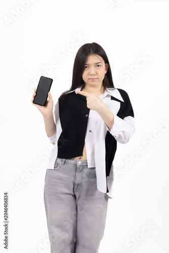Happy young woman holding her smartphone with a cheerful smile