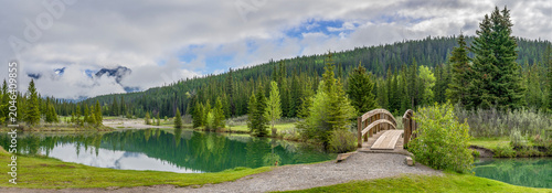 Panorama of Cascade Pond and footbridge in Banff National Park, Alberta, Canada