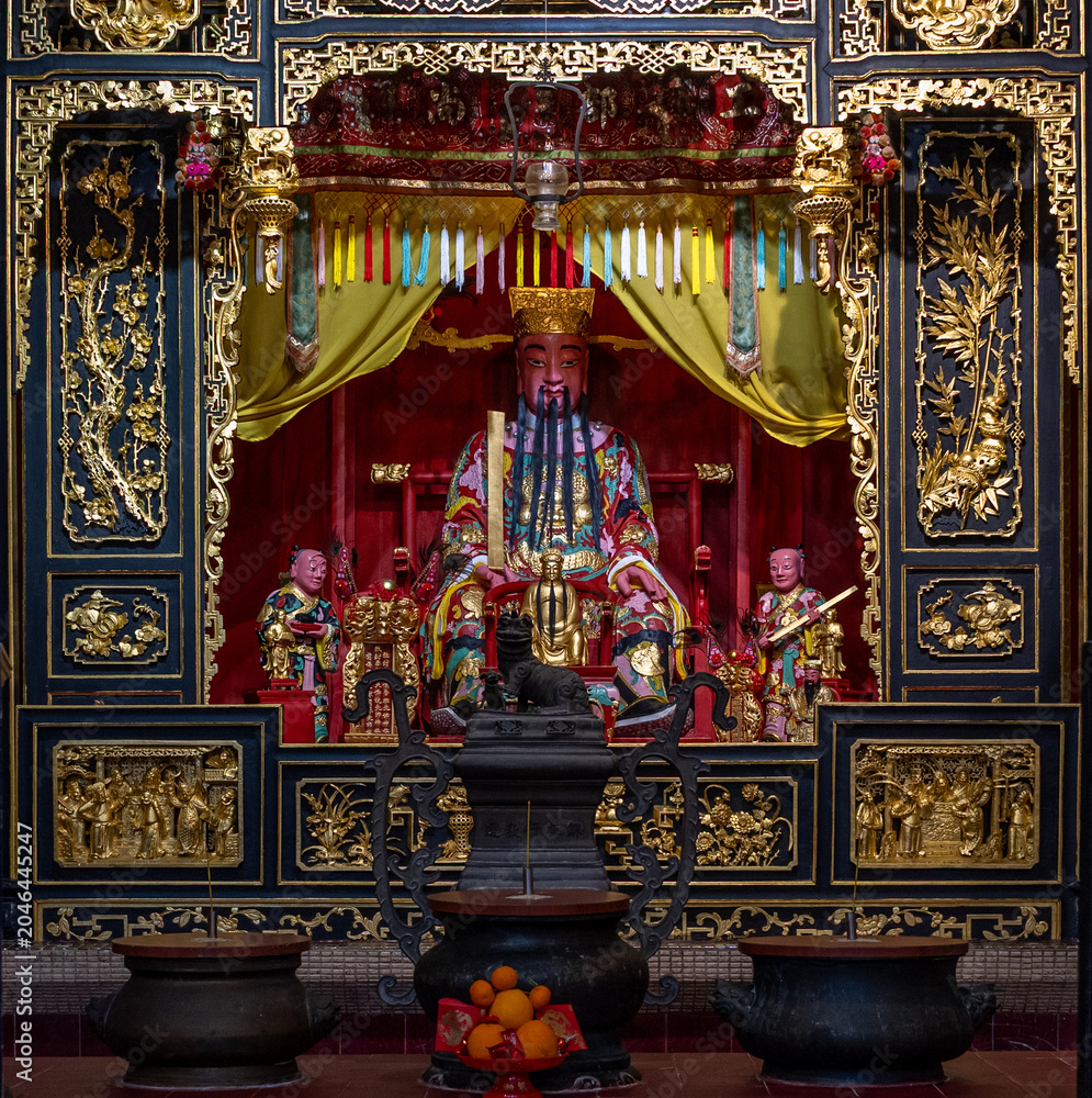 Fototapeta premium Macau, China : richly decorated altar inside a traditional Chinese temple in the historic center of Macau.