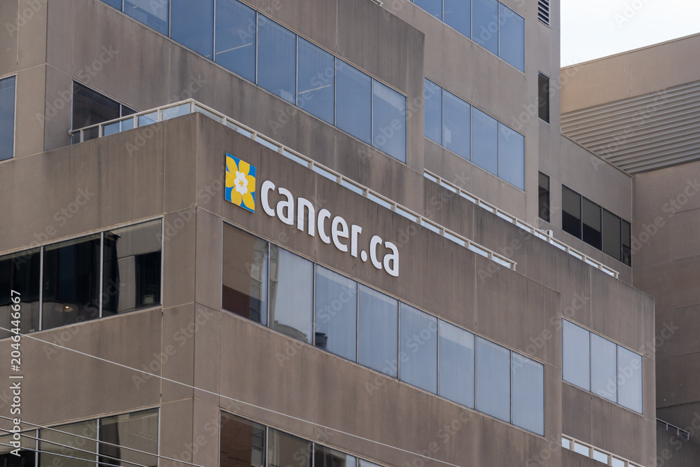 Naklejka premium Toronto, Ontario, Canada - June 2, 2026: Cancer ca sign on the headquarters of the Canadian Cancer Society building on St Clair Avenue West in Toronto, Ontario, Canada. 