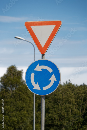 European road signs: give way and roundabout intersection